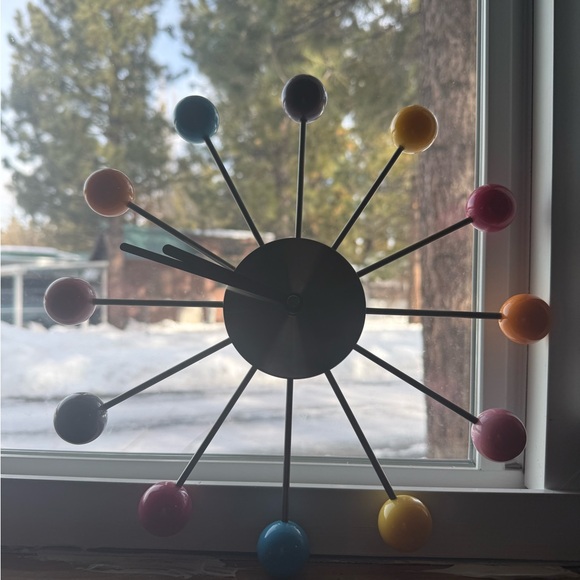 Mid-Century Modern style piece, widely known as a Ball Clock